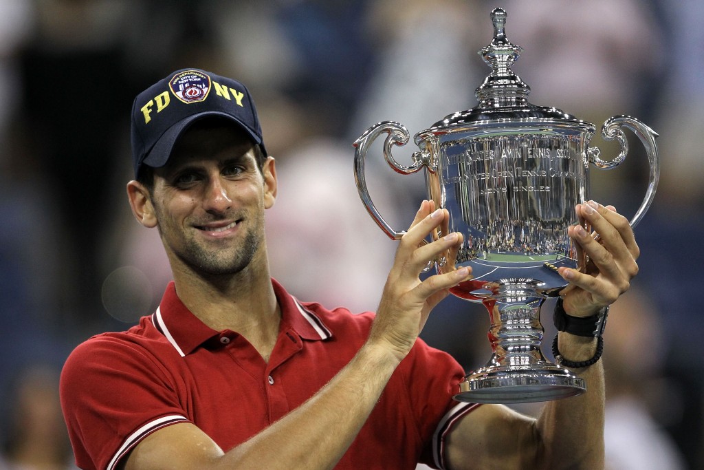 NEW YORK, NY - SEPTEMBER 12:  Novak Djokovic of Serbia celebrates with the trophy after he defeated Rafael Nadal of Spain during the Men's Final on Day Fifteen of the 2011 US Open at the USTA Billie Jean King National Tennis Center on September 12, 2011 in the Flushing neighborhood of the Queens borough of New York City.  (Photo by Matthew Stockman/Getty Images)