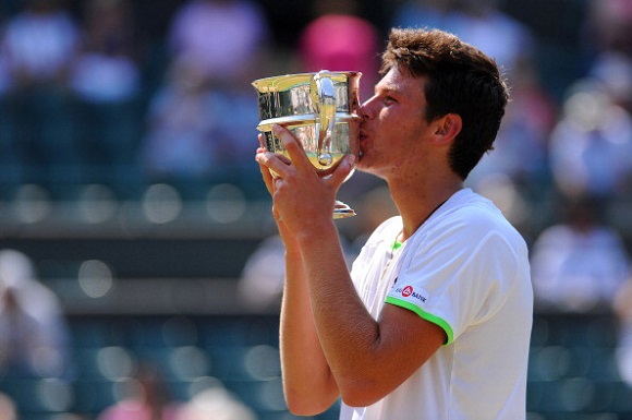 LONDON, ENGLAND - JULY 07: Gianluigi Quinzi of Italy kisses the trophy following his victory in the Boys' Singles Final match against Hyeon Chung of Korea on day thirteen of the Wimbledon Lawn Tennis Championships at the All England Lawn Tennis and Croquet Club on July 7, 2013 in London, England. (Photo by Mike Hewitt/Getty Images)