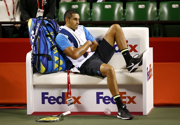 Nick Kyrgios of Australia sits on the bench during his men's singles tennis match against Benoit Paire of France at the Japan Open championships in Tokyo October 9, 2015. REUTERS/Thomas Peter - RTS3P98
